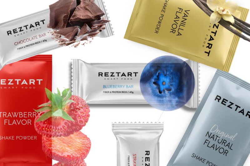 Reztart proteinbars och shakes i olika smaker mot vit bakgrund.